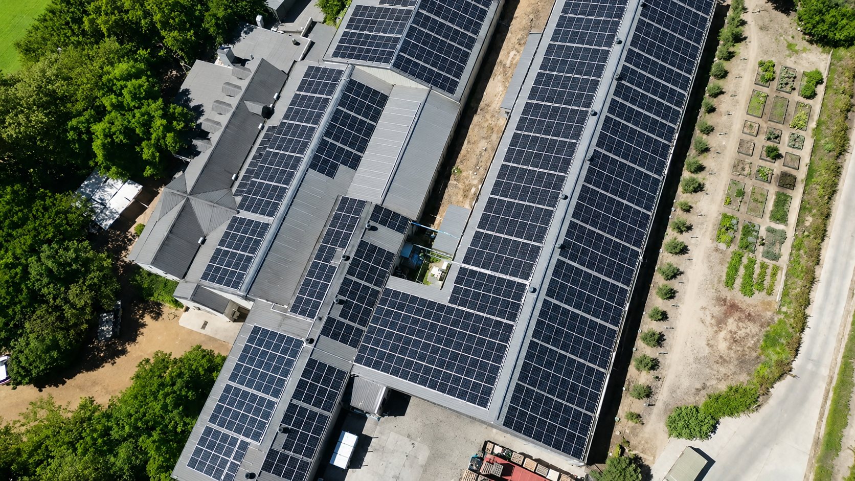 Roof-integrated commercial solar PV infrastructure — installation in progress