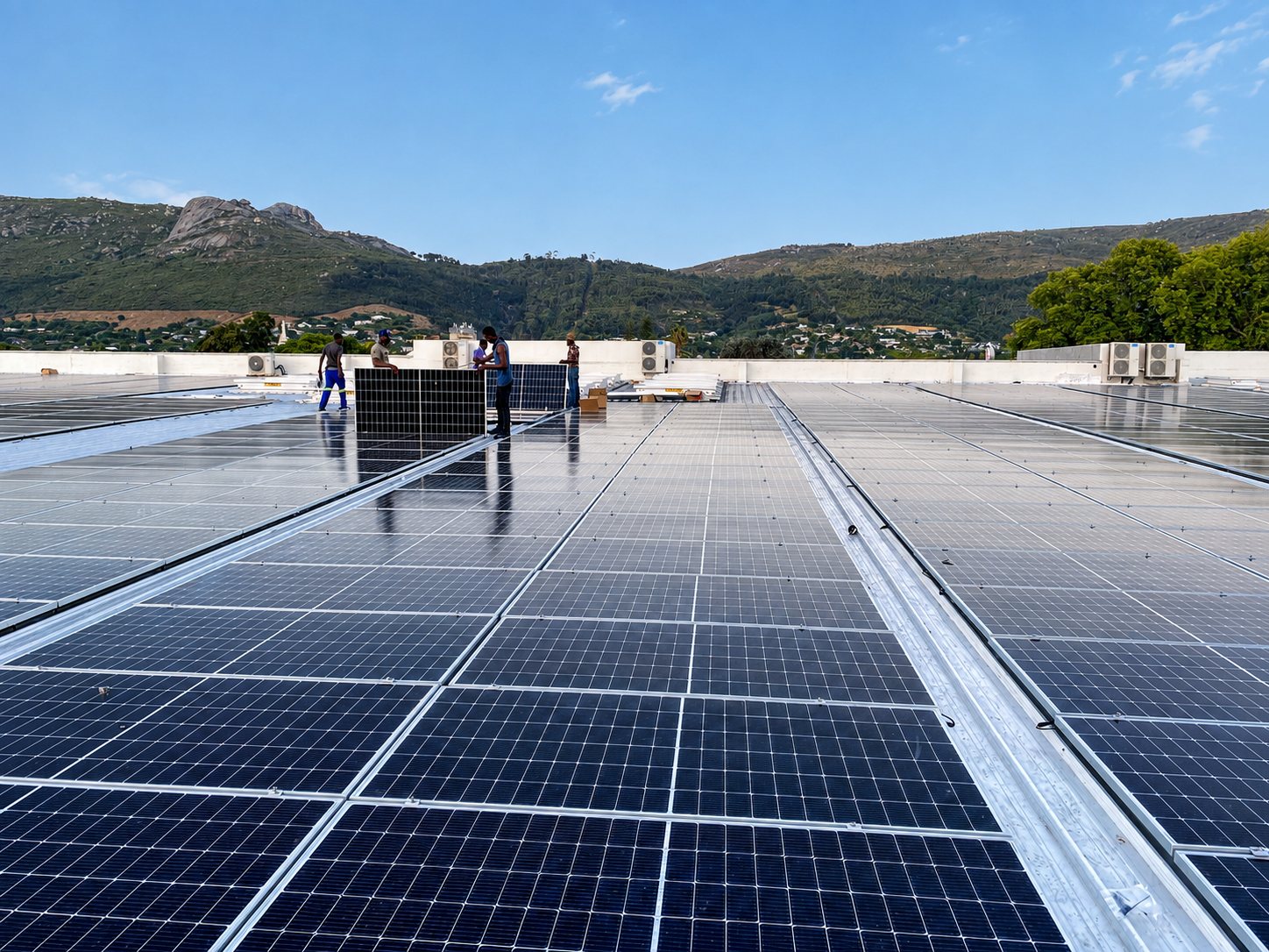 Aerial view of roof-integrated commercial solar PV array